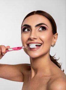 sutton woman with best oral hygiene routine brushing teeth