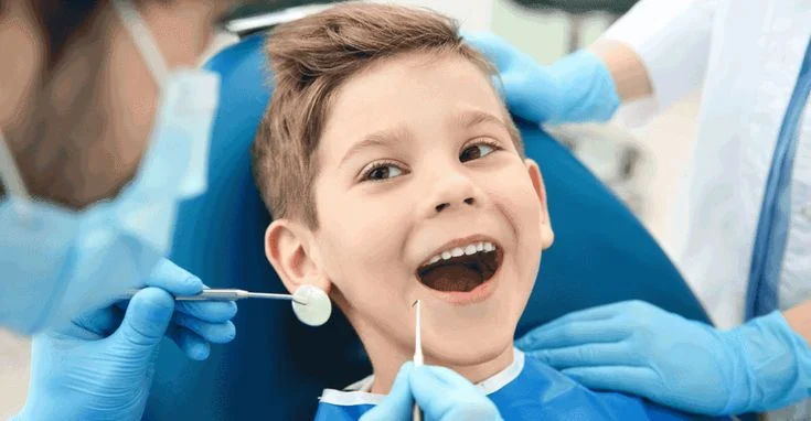 routine general dental care in belmont sutton child at dentist sitting in chair