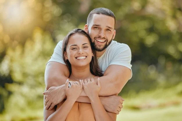 couple hugging smiling with white teeth big smile white dentures